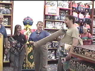 Buffie presents Stephen with a piece of the store&rsquo;s carpet as Denise looks on 