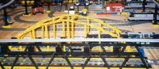 Black truss bridge and yellow arch bridge.