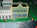 White and green buildings by Greg Kramer